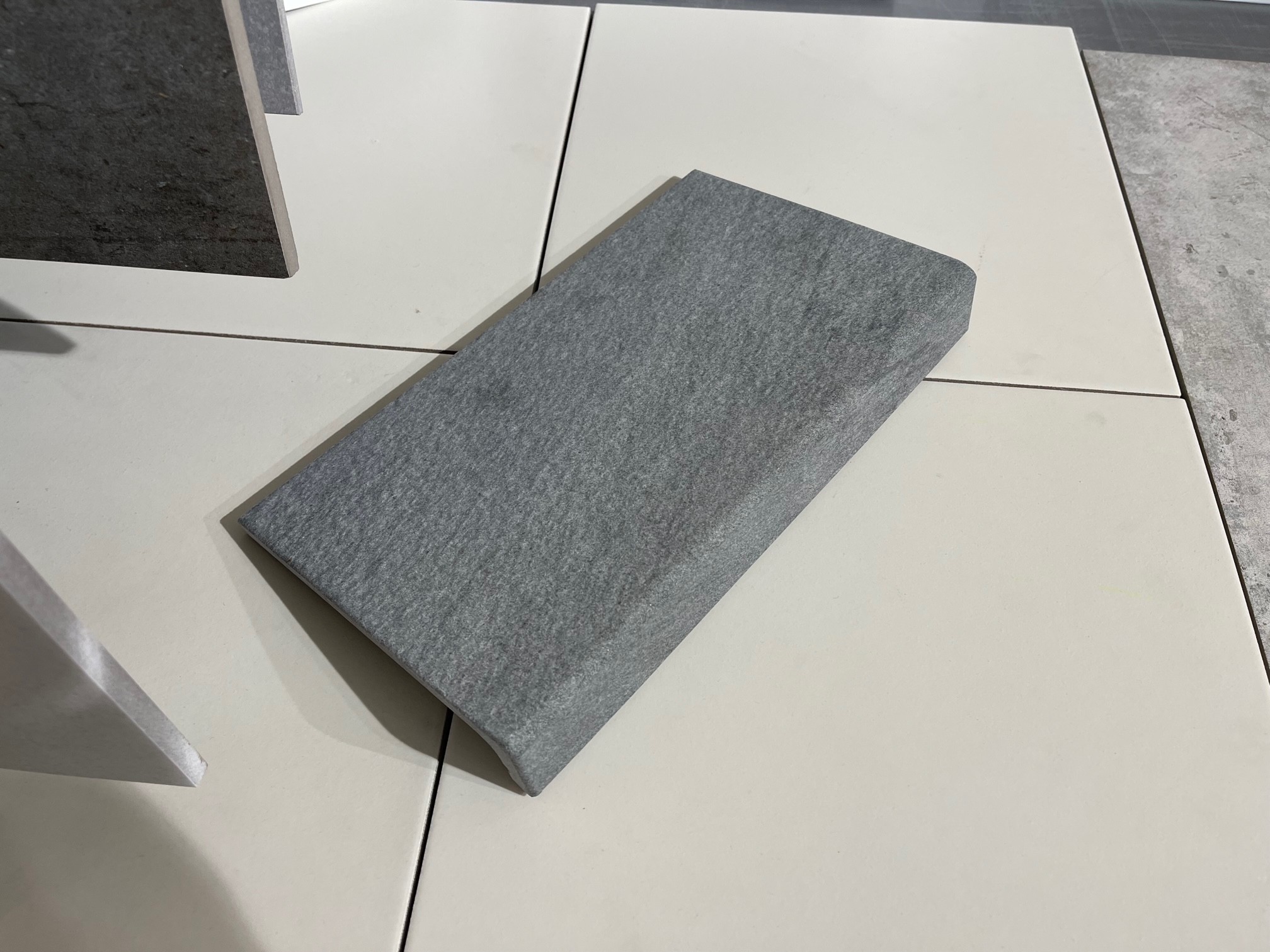 grey monolithic leather element
